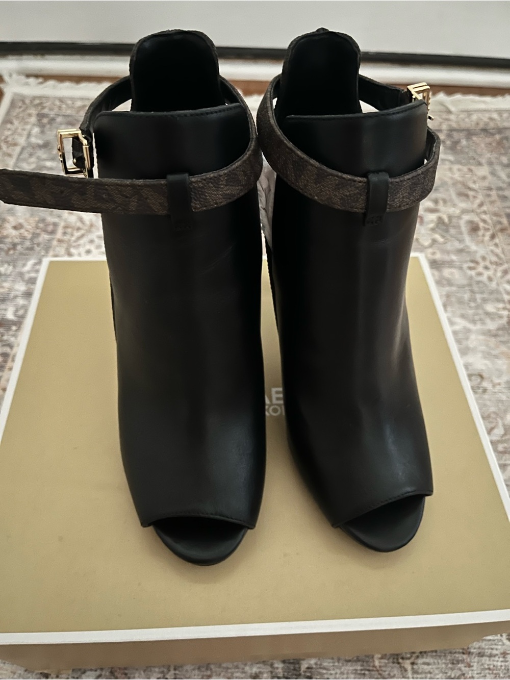 MICHAEL Michael Kors Black Peep-Toe Ankle Booties with Brown Logo Strap
